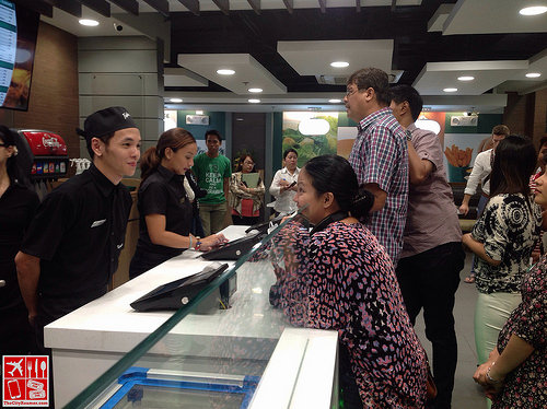 Ordering at the counter of Triple-O's by White Spot SM Megamall