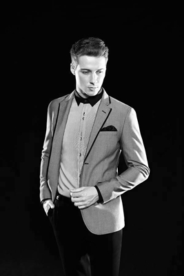 GQ International - Gray Jacket over Light Colored Shirt and Black Pants