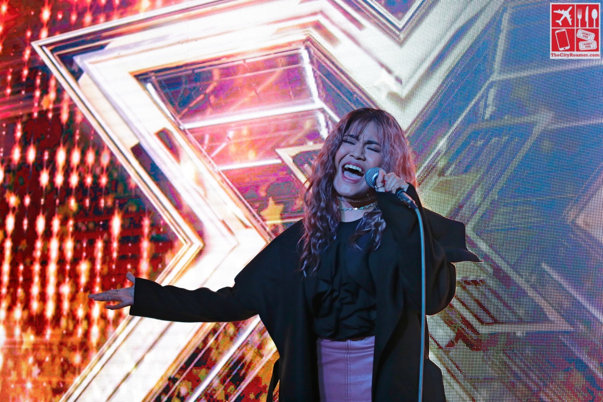 A grown-up Maria Laroco performs during her homecoming event