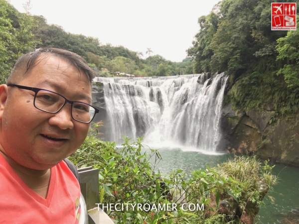 A selfie with the Shifen Waterfall in the background