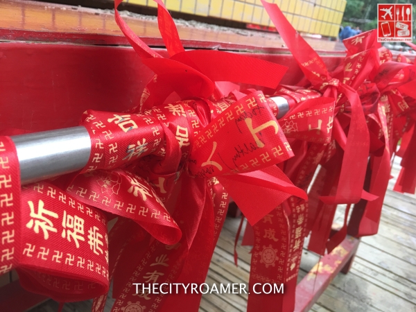 Write your wish on the ribbon and tie it at the altar in Shifen Waterfalls