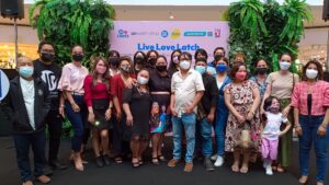 SM Cares for Women and Breastfeeding Program Head, Atty. Pearly Jayagan Turley (front center) with the art contributors of the exhibit in SM North EDSA