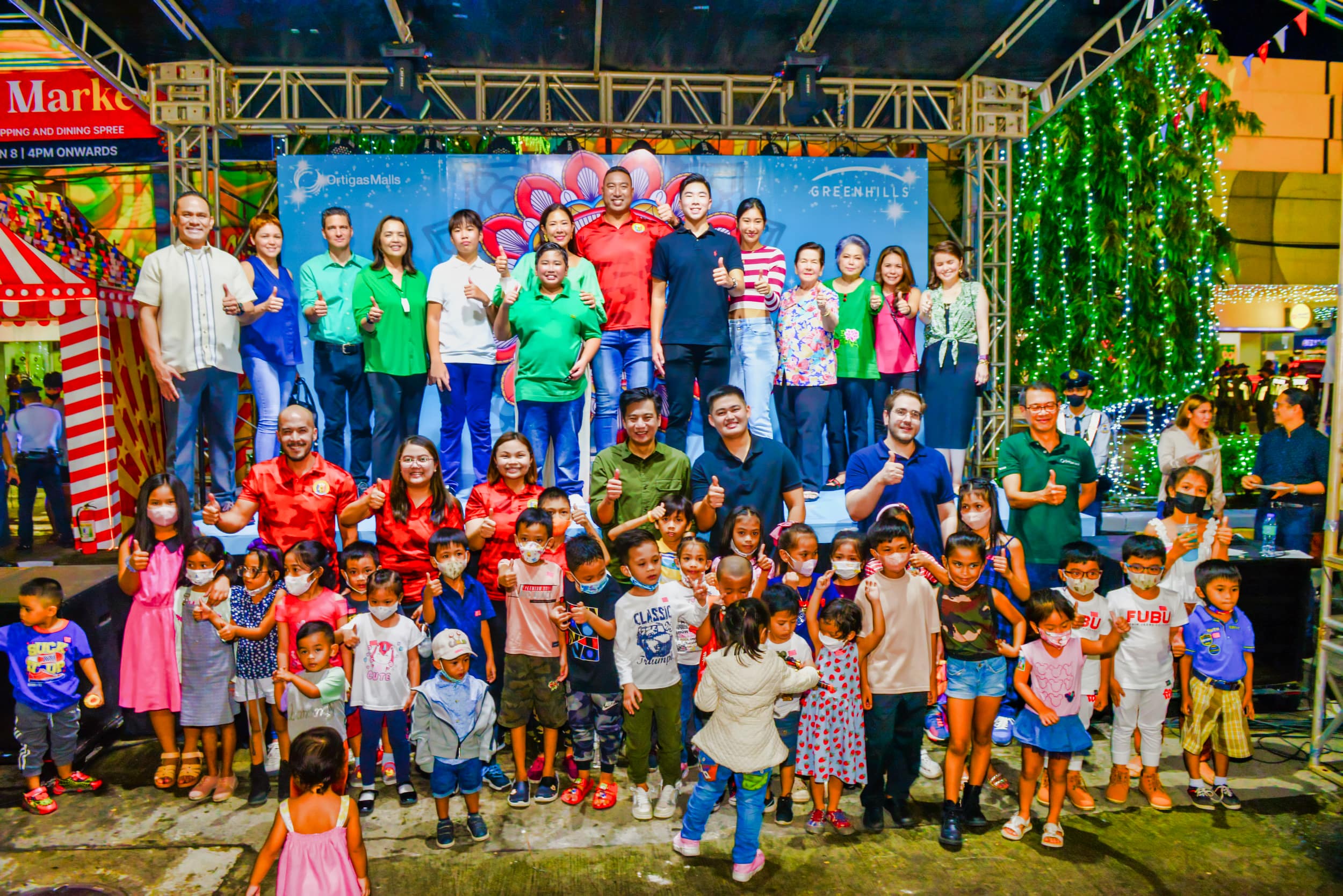 With the kids of Greenhills security, maintenance,and medical frontliners who received gift packs from Ortigas Malls